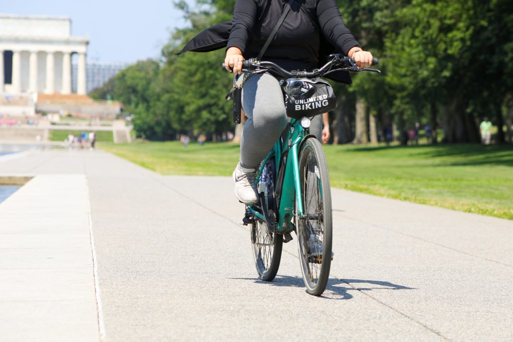 Is Biking in D.C. Safe? 
A woman on a bike in front of the Capitol