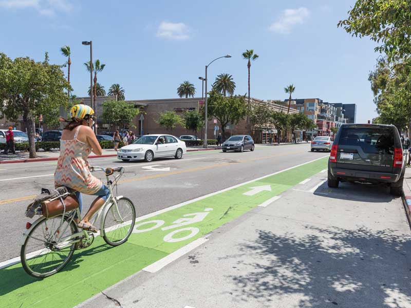 A woman biking in Santa Monica.  